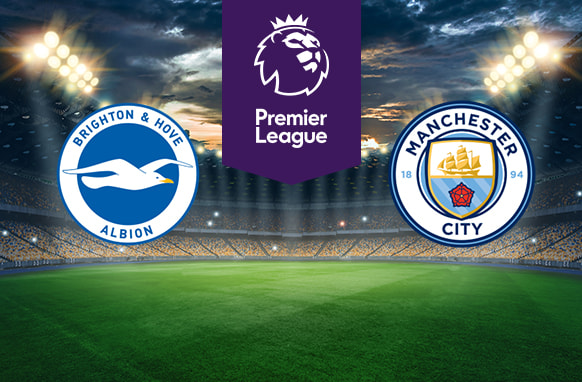 The image shows the logos of two Premier League football clubs, Brighton & Hove Albion and Manchester City, displayed on a football pitch background. The Brighton & Hove Albion logo is on the left side, featuring a white seagull in flight on a blue circle with a white border containing the text "Brighton & Hove Albion." The Manchester City logo is on the right side, featuring a shield with a golden ship above blue waves, a red rose, and the text "Manchester City" along with "1894" on a light blue circle with a navy border. In the centre, there is the Premier League logo, consisting of a lion's head above the text "Premier League." The background depicts a lit football stadium with a dramatic, cloudy sky above, creating an intense and competitive atmosphere.