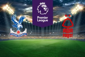 The image shows the logos of two Premier League football clubs, Crystal Palace and Nottingham Forest, displayed on a football pitch background. The Crystal Palace logo is on the left side, featuring an eagle with outstretched wings perched on a football, and a depiction of the Crystal Palace building below, with the text "Crystal Palace F.C." The Nottingham Forest logo is on the right side, featuring a stylized tree with two stars above it and wavy lines representing water below, with the text "Forest." In the centre, there is the Premier League logo, consisting of a lion's head above the text "Premier League." The background depicts a lit football stadium with a dramatic, cloudy sky above, creating an intense and competitive atmosphere.