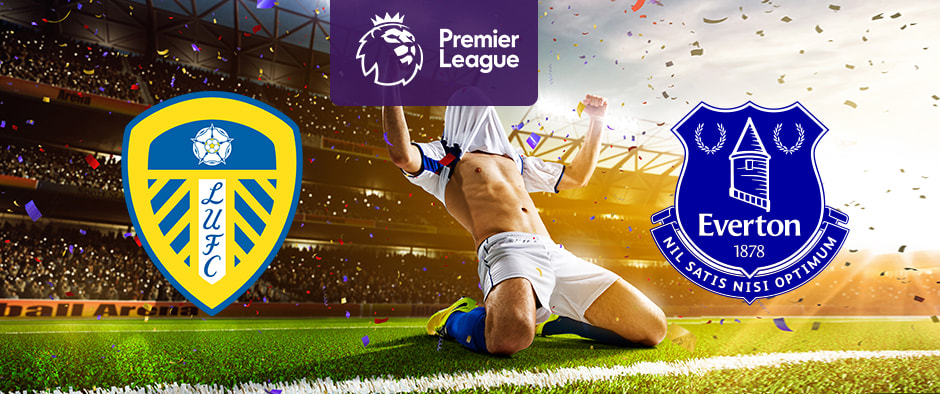 The image shows the logos of two Premier League football clubs, Leeds United and Everton, displayed in front of a jubilant football player who is sliding on his knees in celebration. The Leeds United logo is on the left side, featuring a shield with a white rose on top and blue and yellow stripes, along with the text "LUFC." The Everton logo is on the right side, featuring a royal blue crest with a tower, laurels, and the text "Everton 1878" and "Nil Satis Nisi Optimum." In the centre, there is the Premier League logo, consisting of a lion's head above the text "Premier League." The background depicts a stadium filled with cheering fans and confetti raining down, creating a celebratory atmosphere.