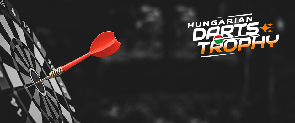 A close-up of a dartboard with a red dart hitting the bullseye. On the right side, the text "Hungarian Darts Trophy" is displayed in bold white and orange letters, with the word "DARTS" incorporating the colors of the Hungarian flag.