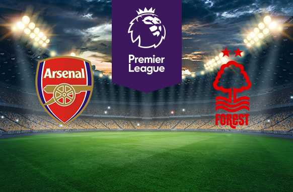 The image shows the logos of two football clubs, Arsenal and Nottingham Forest, displayed on a football pitch. The Arsenal logo is on the left, featuring a red and gold shield with a cannon. The Nottingham Forest logo is on the right, featuring a tree and waves with two stars above it and the word "Forest" below. In the centre above the pitch is the Premier League logo, which includes a lion's head and the text "Premier League" below it on a purple background. The background depicts a stadium with dramatic lighting, creating an intense and vibrant atmosphere.