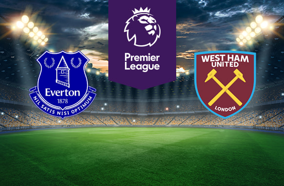 The image shows the logos of two football clubs, Everton and West Ham United, displayed on a football pitch. The Everton logo is on the left, featuring a blue shield with the Prince Rupert's Tower in the centre, flanked by laurel wreaths with the text "Everton" and the year "1878" below it, as well as the Latin motto "Nil Satis Nisi Optimum". The West Ham United logo is on the right, featuring a claret and blue shield with two crossed hammers and the text "West Ham United London". In the centre above the pitch is the Premier League logo, which includes a lion's head and the text "Premier League" below it on a purple background. The background depicts a stadium with dramatic lighting, creating an intense and vibrant atmosphere.