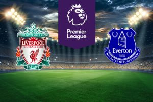 An illuminated football stadium backdrop. In the center, a purple Premier League logo. On the left, the Liverpool Football Club emblem with