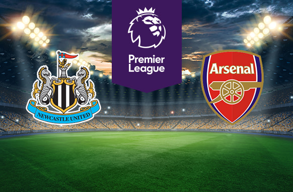 The image shows the logos of two football clubs, Newcastle United and Arsenal, displayed on a football pitch. The Newcastle United logo is on the left, featuring a shield with two seahorses, a stylised castle, and a flag, with the text "Newcastle United" on a banner at the bottom. The Arsenal logo is on the right, featuring a red and white shield with a cannon and the text "Arsenal" in white. The Premier League logo in the centre above the pitch, which includes a lion's head and the text "Premier League" below it on a purple background. The background depicts a stadium with dramatic lighting, creating an intense and vibrant atmosphere.
