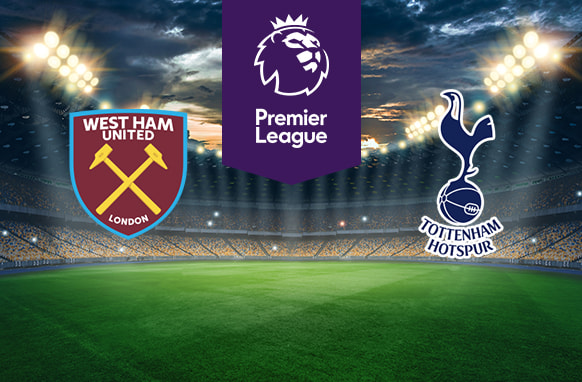The image shows the logos of two football clubs, West Ham United and Tottenham Hotspur, displayed on a football pitch. The West Ham United logo is on the left, featuring a shield with crossed hammers and the text "West Ham United London." The Tottenham Hotspur logo is on the right, featuring a cockerel standing on a football with the text "Tottenham Hotspur" below. In the centre above the pitch is the Premier League logo, which includes a lion's head and the text "Premier League" below it on a purple background. The background depicts a stadium with dramatic lighting and a twilight sky, creating an intense and vibrant atmosphere.
