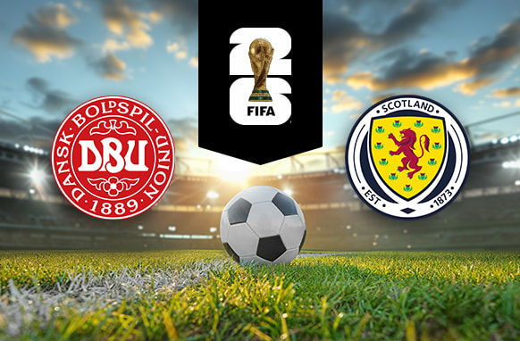 The image shows the logos of two national football associations, the Danish Football Association and the Scottish Football Association, displayed on a football pitch with a football in the centre. The Danish logo is on the left, featuring a red circular design with the text "Dansk Boldspil-Union" and "1889." The Scottish logo is on the right, featuring a yellow shield with a red lion and the text "Scotland" and "Est. 1873." In the centre above the football is the FIFA logo, which includes the FIFA World Cup Trophy and "FIFA" below it on a black background. The background depicts a stadium with dramatic sky lighting, creating a dynamic and intense atmosphere.