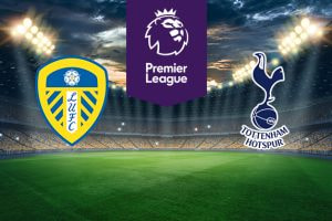 The image shows the logos of two football clubs, Leeds United and Tottenham Hotspur, displayed on a football pitch. The Leeds United logo is on the left, featuring a yellow and blue shield with a white rose at the top and the letters