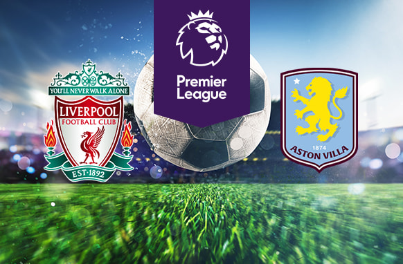 The image features logos of two Premier League football teams. On the left is Liverpool's logo with "You'll Never Walk Alone" above it. On the right is Aston Villa's logo with a lion and the year 1874. Above the logos is the Premier League logo with a lion's head and "Premier League" on a purple background. In the background, a stadium is visible with a large football in the centre, creating an atmosphere of anticipation.