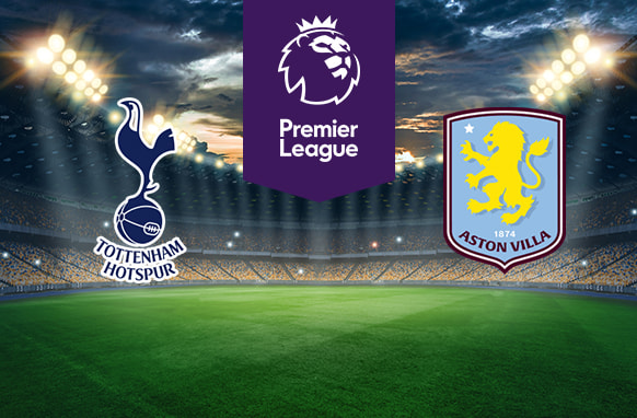 The image features two Premier League football team logos on a football pitch. On the left is Tottenham Hotspur's logo, which shows a cockerel standing on a football above the club's name. On the right is Aston Villa's logo, featuring a yellow lion rampant and the club's name on a light blue shield. In the centre is the Premier League logo with a stylised lion's head and the words "Premier League" on a purple stripe. The background shows a stadium with bright lights and a dramatic sky, creating an atmosphere of anticipation and excitement.