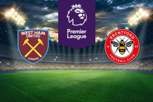The image features two Premier League football team logos on a football pitch. On the left is West Ham United's logo, displaying crossed hammers on a claret shield with the club's name and "London" beneath it. On the right is Brentford's logo, featuring a bee with the club's name and year of establishment (1889) encircling it on a red and white badge. In the centre is the Premier League logo with a stylised lion's head and the words "Premier League" on a purple stripe. The background shows a stadium with bright lights and a dramatic sky, creating an atmosphere of anticipation and excitement.