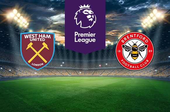 The image features two Premier League football team logos on a football pitch. On the left is West Ham United's logo, displaying crossed hammers on a claret shield with the club's name and "London" beneath it. On the right is Brentford's logo, featuring a bee with the club's name and year of establishment (1889) encircling it on a red and white badge. In the centre is the Premier League logo with a stylised lion's head and the words "Premier League" on a purple stripe. The background shows a stadium with bright lights and a dramatic sky, creating an atmosphere of anticipation and excitement.