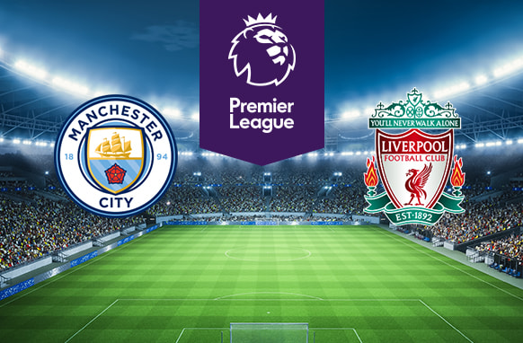 The image features the logos of two Premier League football teams. On the left is Manchester City Football Club's logo with a ship and shield. On the right is Liverpool Football Club's logo with the Liver bird and their motto "You'll Never Walk Alone.” Above the logos is the Premier League logo with a lion's head and "Premier League" on a purple background. The background shows a brightly lit stadium filled with spectators, creating an atmosphere of excitement and anticipation.