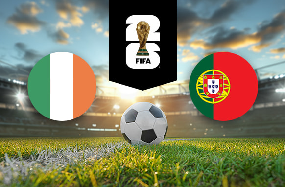 The image features logos and flags representing two football teams participating in an international event. On the left is the flag of Ireland, which consists of three vertical stripes in green, white, and orange. On the right is the flag of Portugal, featuring a red and green background with a coat of arms in the middle. Above the flags is the FIFA 2022 World Cup logo, depicting the World Cup trophy. The background depicts a brightly lit stadium at sunset, with a football placed on the pitch in the centre, creating an atmosphere of competition and anticipation for the upcoming match.